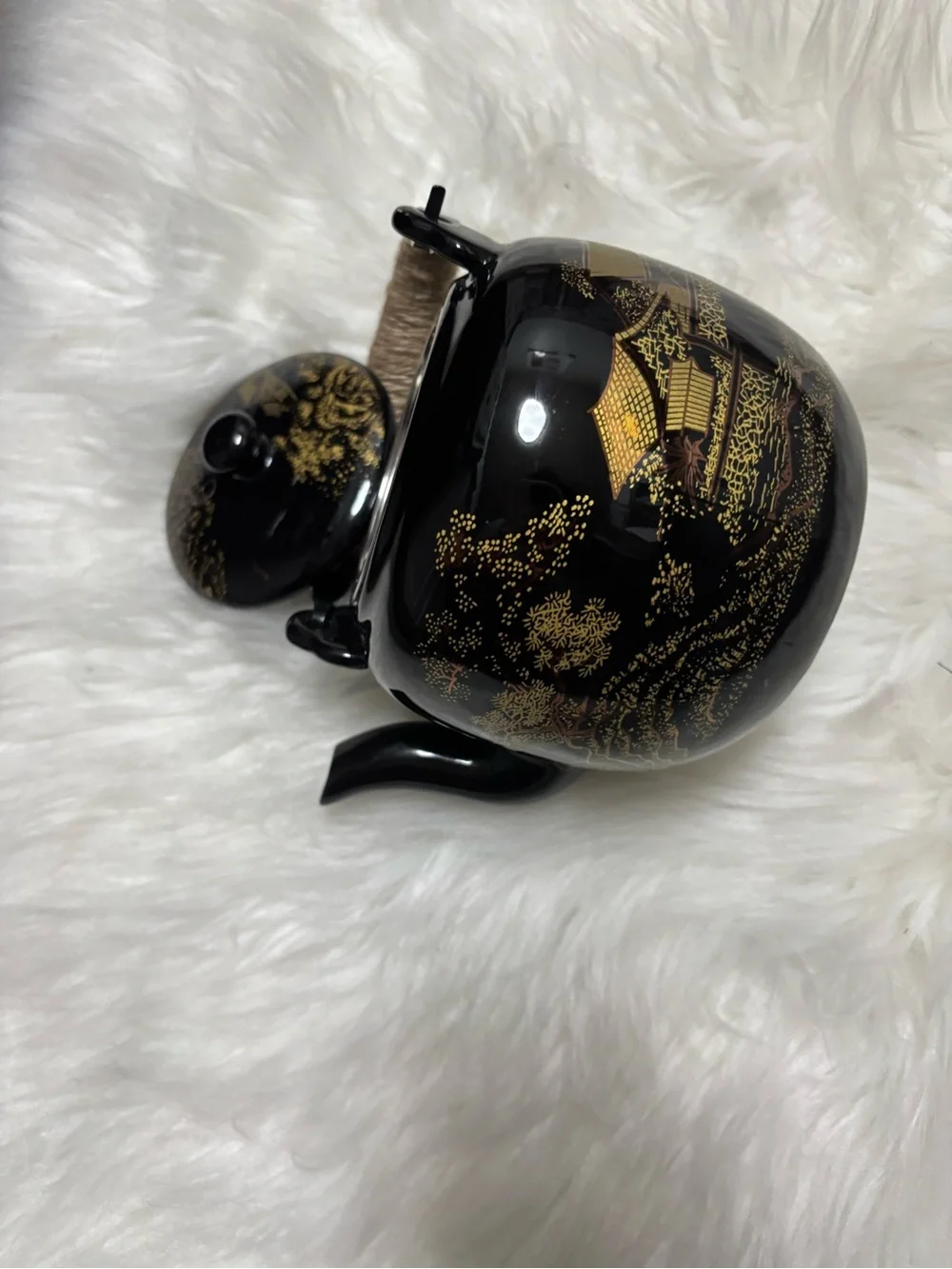 Black and Gold Ceramic Teapot with Woven Handle